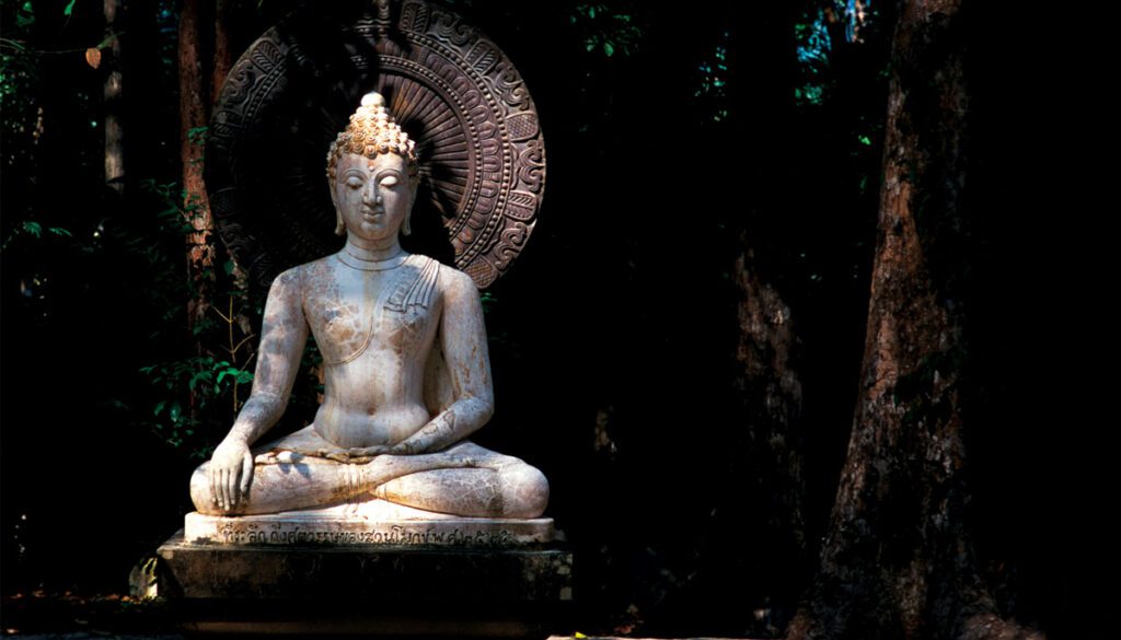 Buddha statue holding flowers.