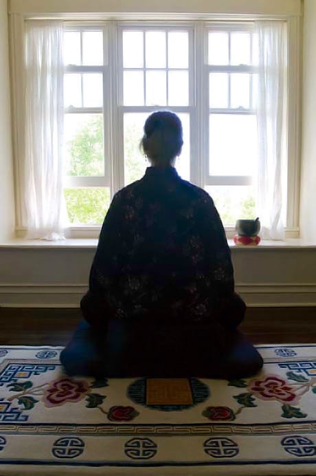 Woman meditating. Photo by Liza Matthews.