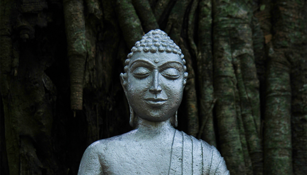 Sculpture of Shakyamuni Buddha sitting and touching the earth.